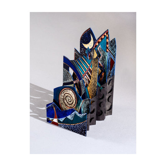 Ultramarino – large dramatic carousel book by Ruiz opened to panoramic seascape in deep blue, gold, and teal with wave forms, spirals, and boat elements across the full length