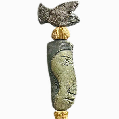 Stone Perch 1 by Zimmerman – detail of flat fish at crown with incised geometric marks and long sideways-looking face in coral-bronze ceramic totem