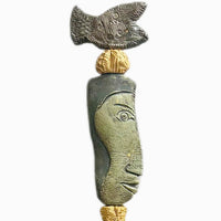 Stone Perch 1 by Zimmerman – detail of flat fish at crown with incised geometric marks and long sideways-looking face in coral-bronze ceramic totem