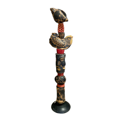 The Black Shell by Zimmerman – detail of black and cream conch shell with bold floral marks at crown of nocturnal totem