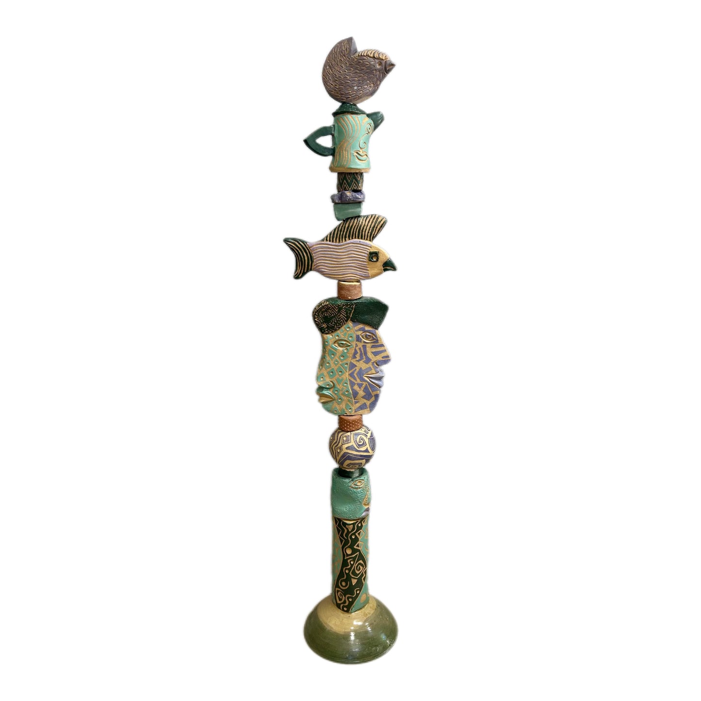Juxtaposition 2 Ceramic Totem – hand-built ceramic totem by Zimmerman with small bird at top, large fish spreading wide in purple, gold, and black stripes, teal and purple geometric face below, bold black and gold abstract base marks from printmaking vocabulary