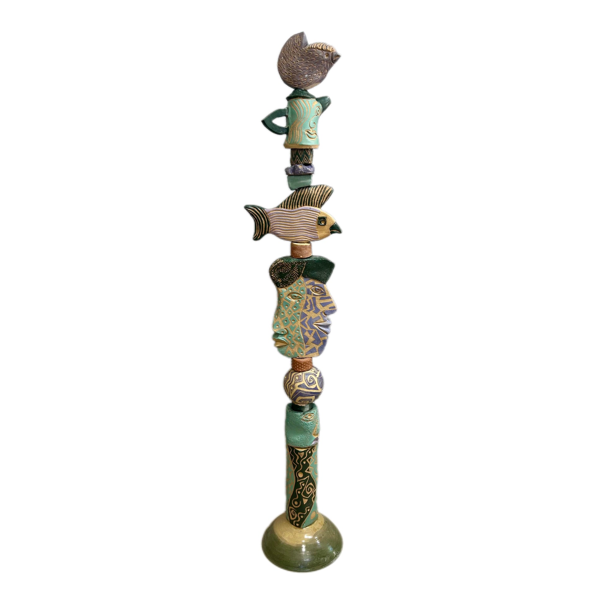 Juxtaposition 2 Ceramic Totem – hand-built ceramic totem by Zimmerman with small bird at top, large fish spreading wide in purple, gold, and black stripes, teal and purple geometric face below, bold black and gold abstract base marks from printmaking vocabulary