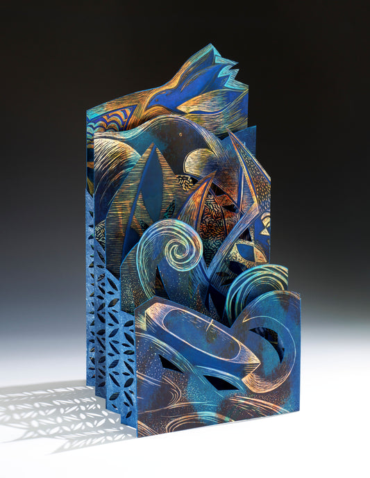 Resiliency I – sculptural accordion book by Ruiz standing upright with hand-printed layers of waves, spirals, and boat forms in deep blue, copper, and gold viewable from multiple angles