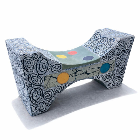 Day Break – studio raku ceramic bench by Gustavson with deep grey-black ground, fine spiralling hand-drawn glaze patterns, and circular colour forms locked by reduction firing