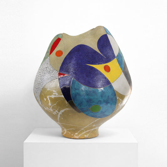 Beautiful Dream – ceramic vessel by Gustavson with deep indigo glaze over sandy ground with passages of red, yellow, and teal