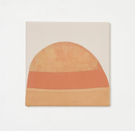 PORTAL X – hand-dyed textile artwork by Panda Landa with gentle arcs of sun-warmed ochre and muted coral resting against calm neutral ground, evoking horizon or threshold, fabric stretched over stretcher bars