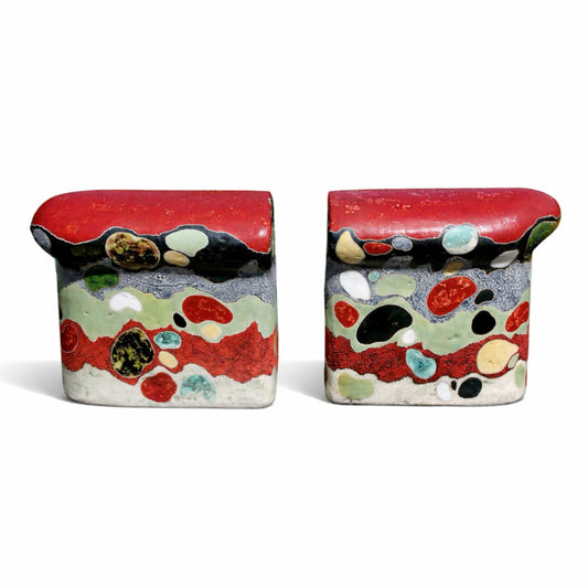 Gemstones – studio raku ceramic by Gustavson with deep red and black ground and rounded areas of green, cream, and earth tones set like polished stones using pine needle reduction firing