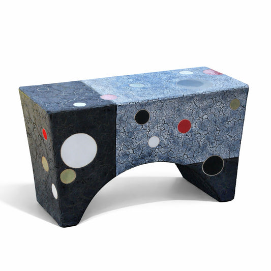 Black Beauty – studio raku ceramic bench by Gustavson with deep grey-black reduction-fired ground and circular colour forms in red, white, and earth tones