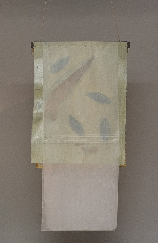 Untitled Green – suspended textile work by Terese Garcia with sheer translucent panels in pale ivory and softest sage green hanging from thin rod, faint leaf-like forms pressed between layers and casting shadow
