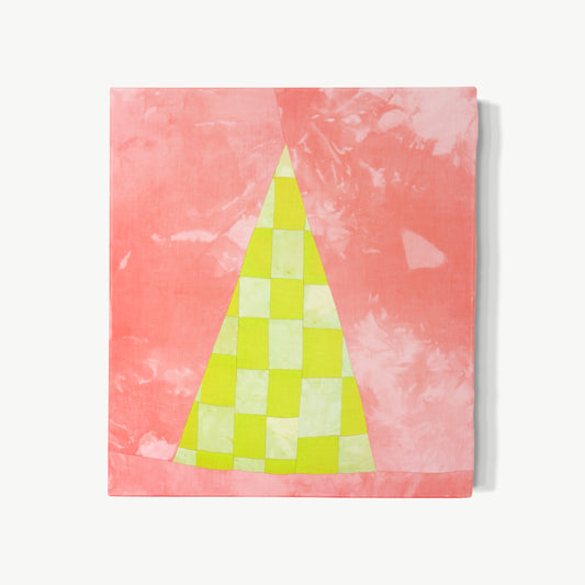 VESSEL II – hand-dyed textile artwork by Panda Landa with triangular vessel form and luminous chartreuse and pale interior glowing against warm pink ground, subtle dye variations giving depth and human touch