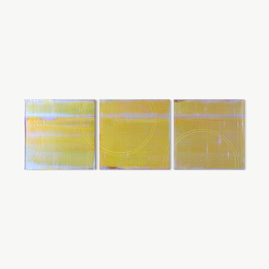 Moving Through the Horizon Triptych – three-panel painting by Koury in warm chartreuse and yellow-green with silver-white striations and a large unifying circle drawn across panels from the Back to Basics series