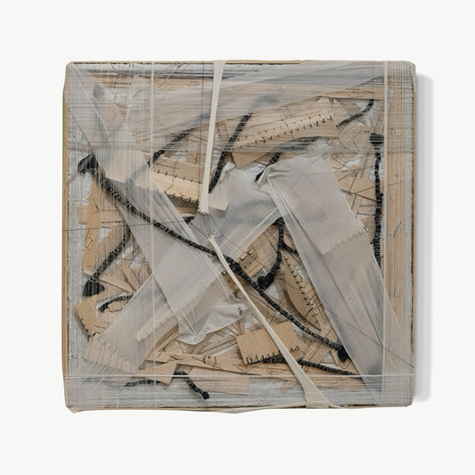 Nineteen – layered work by Terese Garcia with paper, fabric, and material pressing into each other across warm parchment and cream ground, dark marks caught beneath translucent overlay, each layer a record of attention