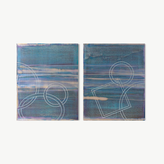 How Deep Is Your Ocean Diptych – two-panel painting by Koury in deep teal and steel blue with white-drawn circles, rectangles, and organic shapes and horizontal silver bands suggesting ocean strata and water layers