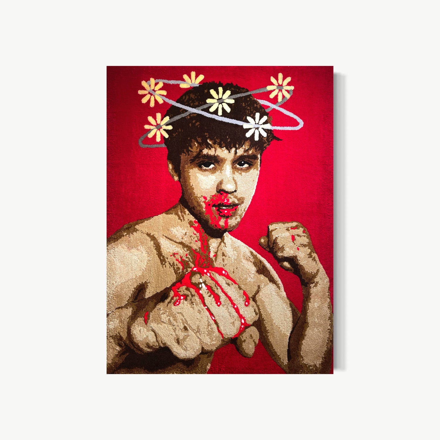 Phosphenes – largest tufted acrylic yarn artwork by Cedric Vu at 72 by 53 inches showing boxer self portrait with fists raised, blood at nose and chest, and ring of daisy flowers orbiting head like flashes seen after a hit