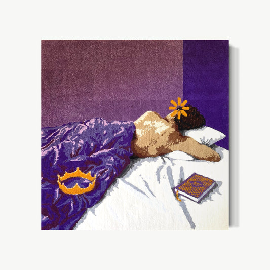 I Love Machiavelli but the Storyline for Me Has Run Stale – tufted acrylic yarn artwork by Cedric Vu with figure face-down on luxuriously dense purple yarn bed, golden crown at feet and orange flower on back, wry cinematic humor and surprising tenderness