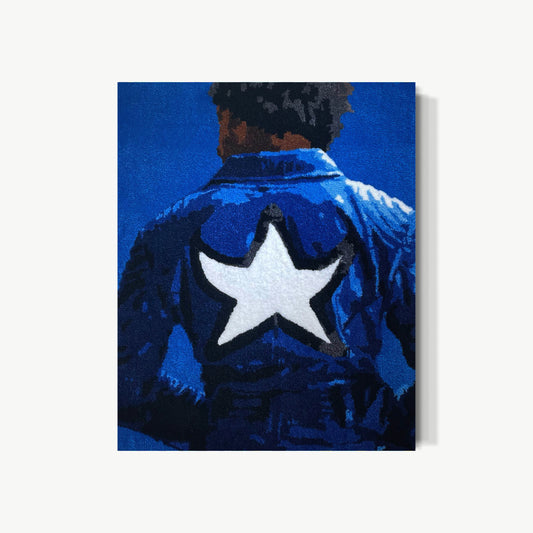 Duckwrth Dared Me – tufted acrylic yarn artwork by Cedric Vu with figure in deep blue denim jacket back-turned, white star centered between shoulder blades, quiet confidence in what the portrait chooses not to reveal