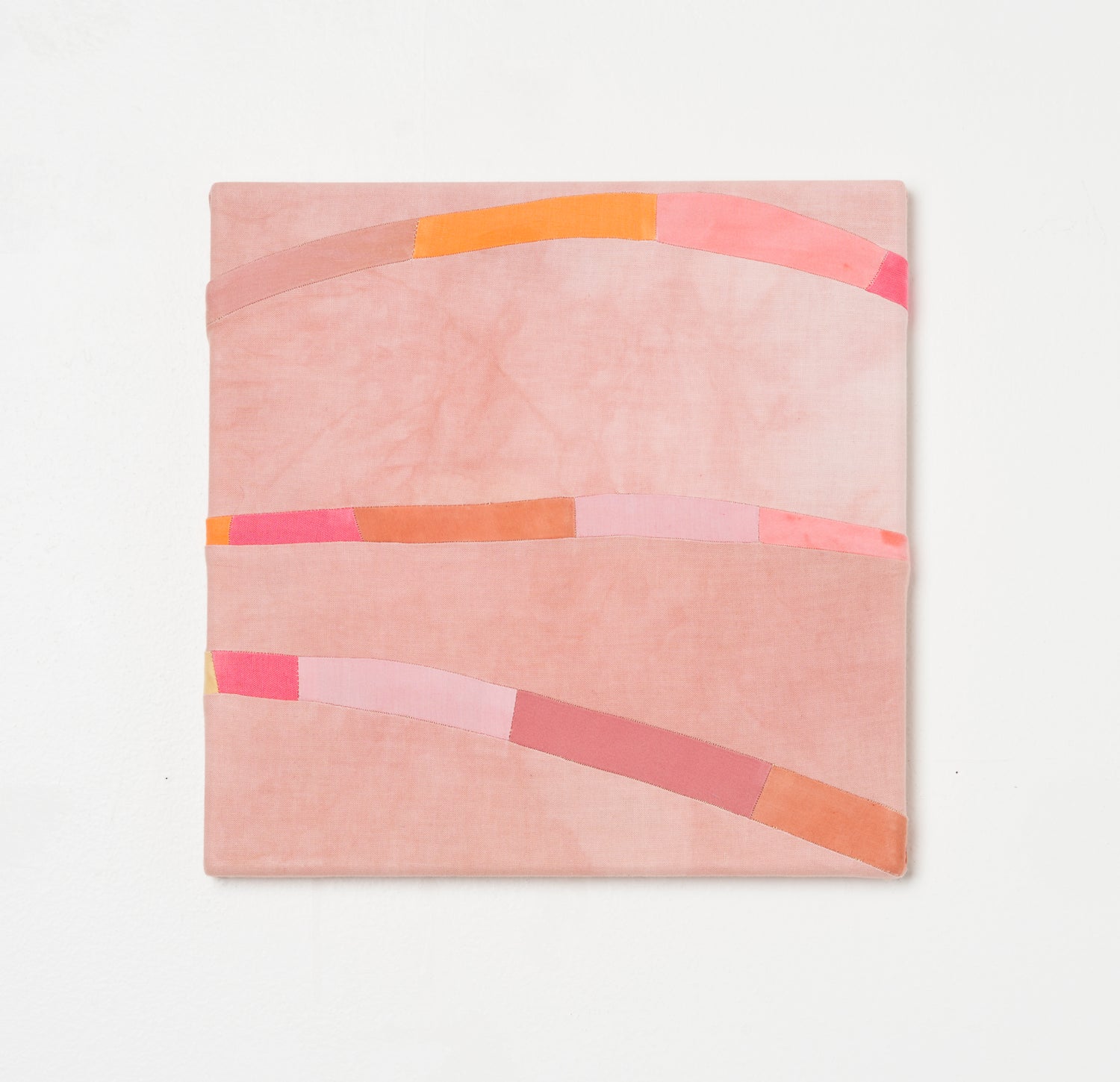 RITUAL IV – hand-dyed textile artwork by Panda Landa with restrained palette of warm blush and coral in stitched flowing bands creating gentle visual rhythm with meditative calm characteristic of the Ritual series